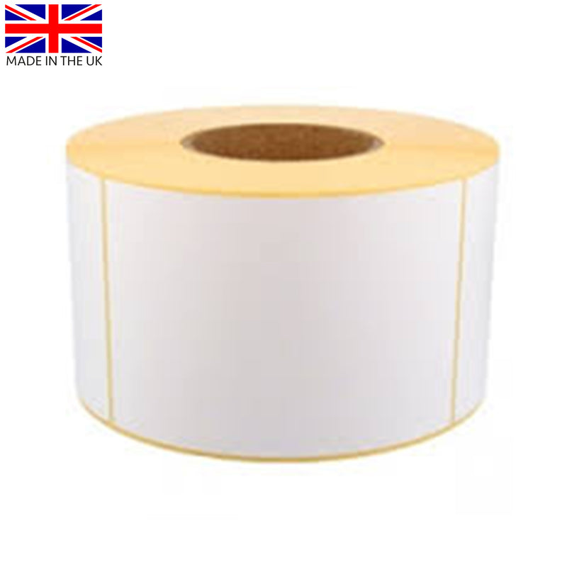 Single roll of white direct thermal labels with yellow backing paper, sitting upright on a white surface