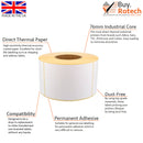 Single roll of white direct thermal labels with yellow backing paper, sitting upright on a white surface, labelled with descriptive features