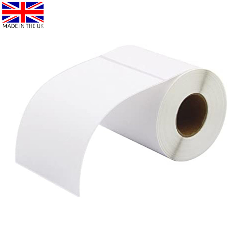 Slightly unravelled single roll of white thermal transfer labels with white backing paper sitting sideways on a white surface